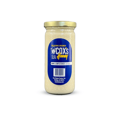11 oz Glass Jar of Cox's Honey on a white background