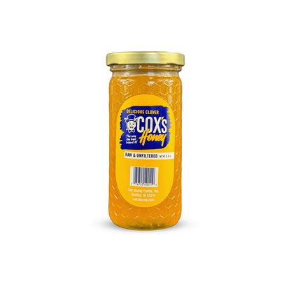 11 oz Glass Jar of Cox's Honey on a white background