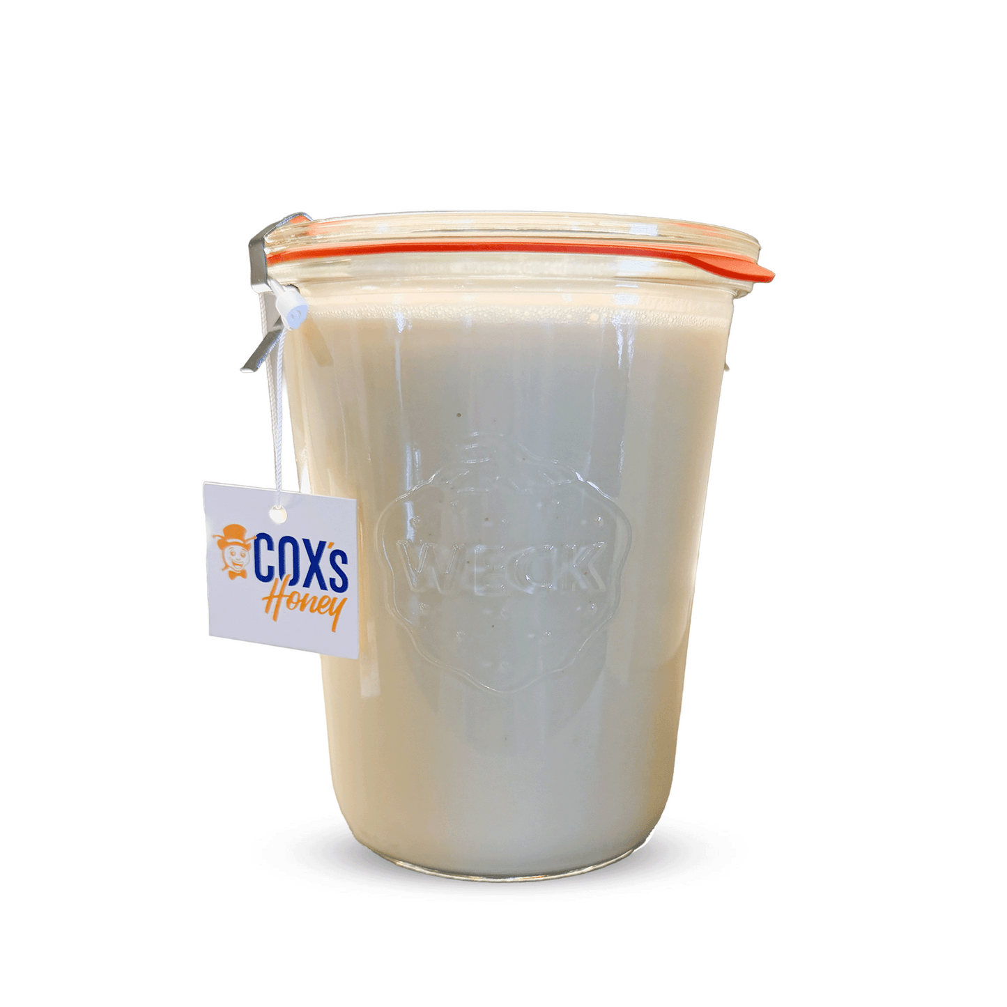 Jar of honey with a Coxs Honey tag on a white background
