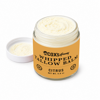 Jar of Coxs Honey Whipped Tallow Balm with lid on a white background