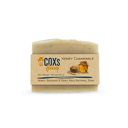 Bar of honey chamomile soap with a Coxs Honey label on a white background