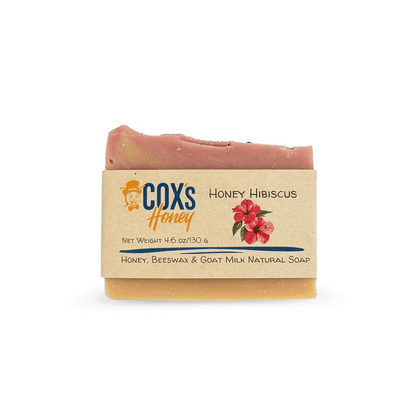 Bar of honey hibiscus soap with Coxs Honey branding on a white background