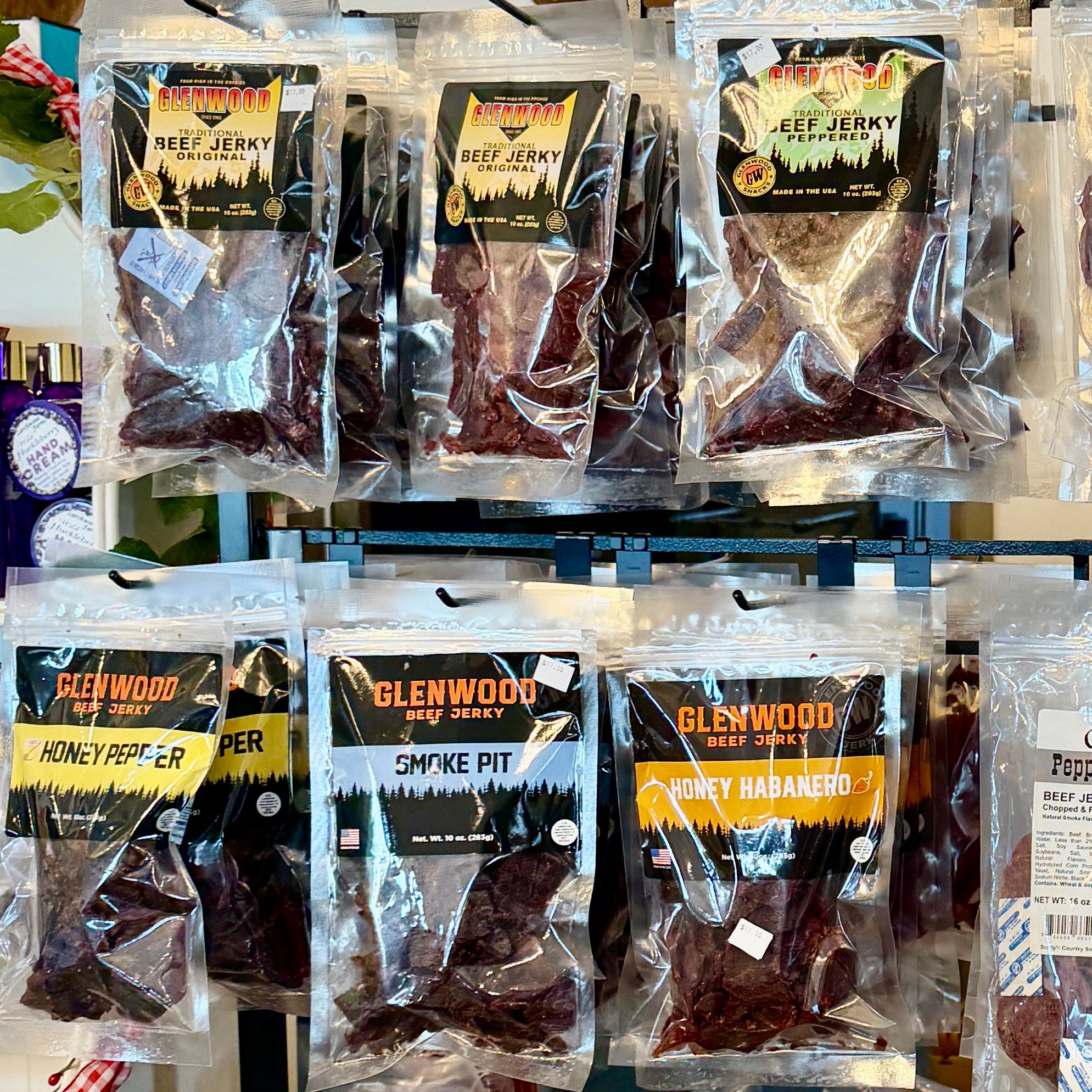 Assorted packages of Glenwood Beef Jerky on a shelf.