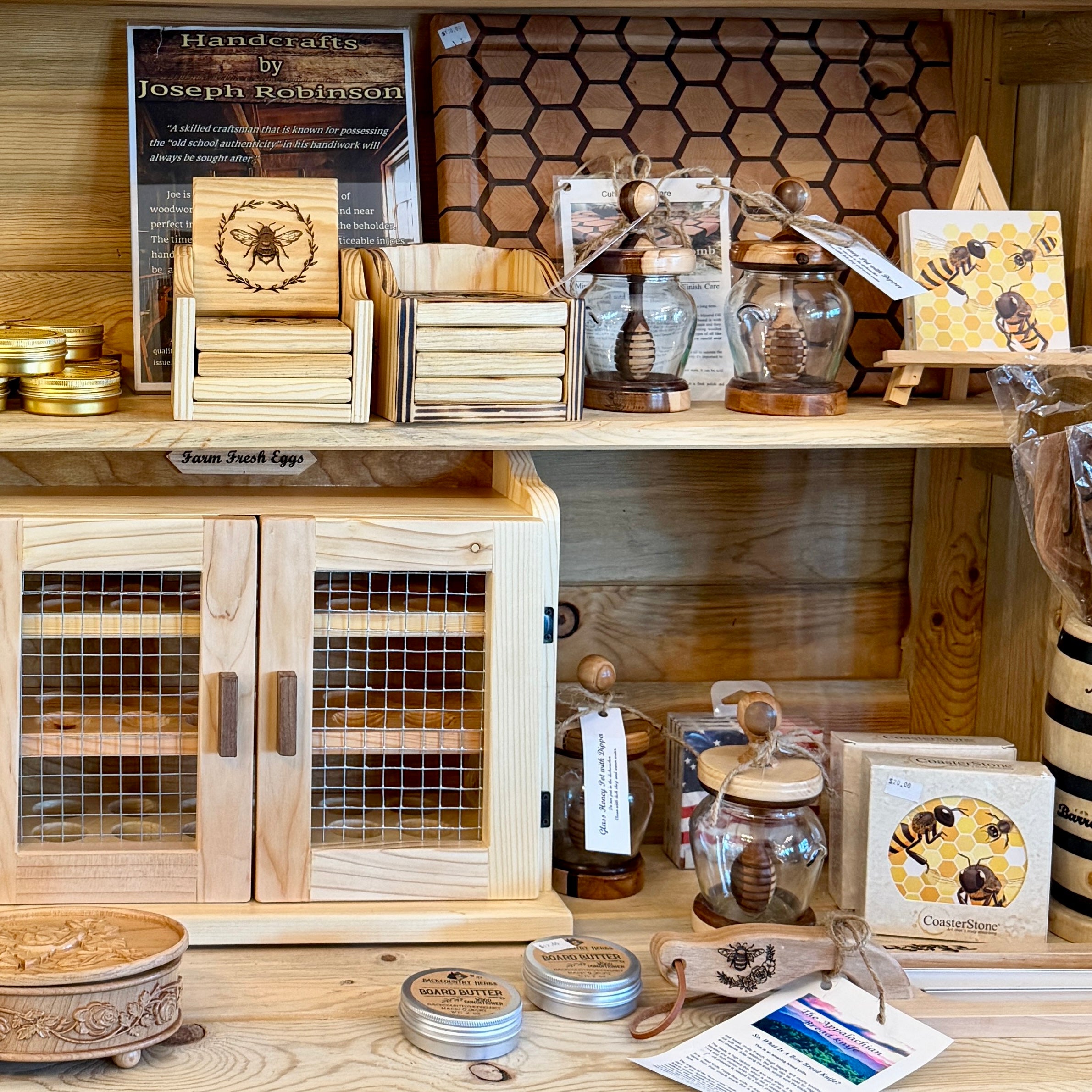 Wooden shelf with various handcrafted items and a cabinet.