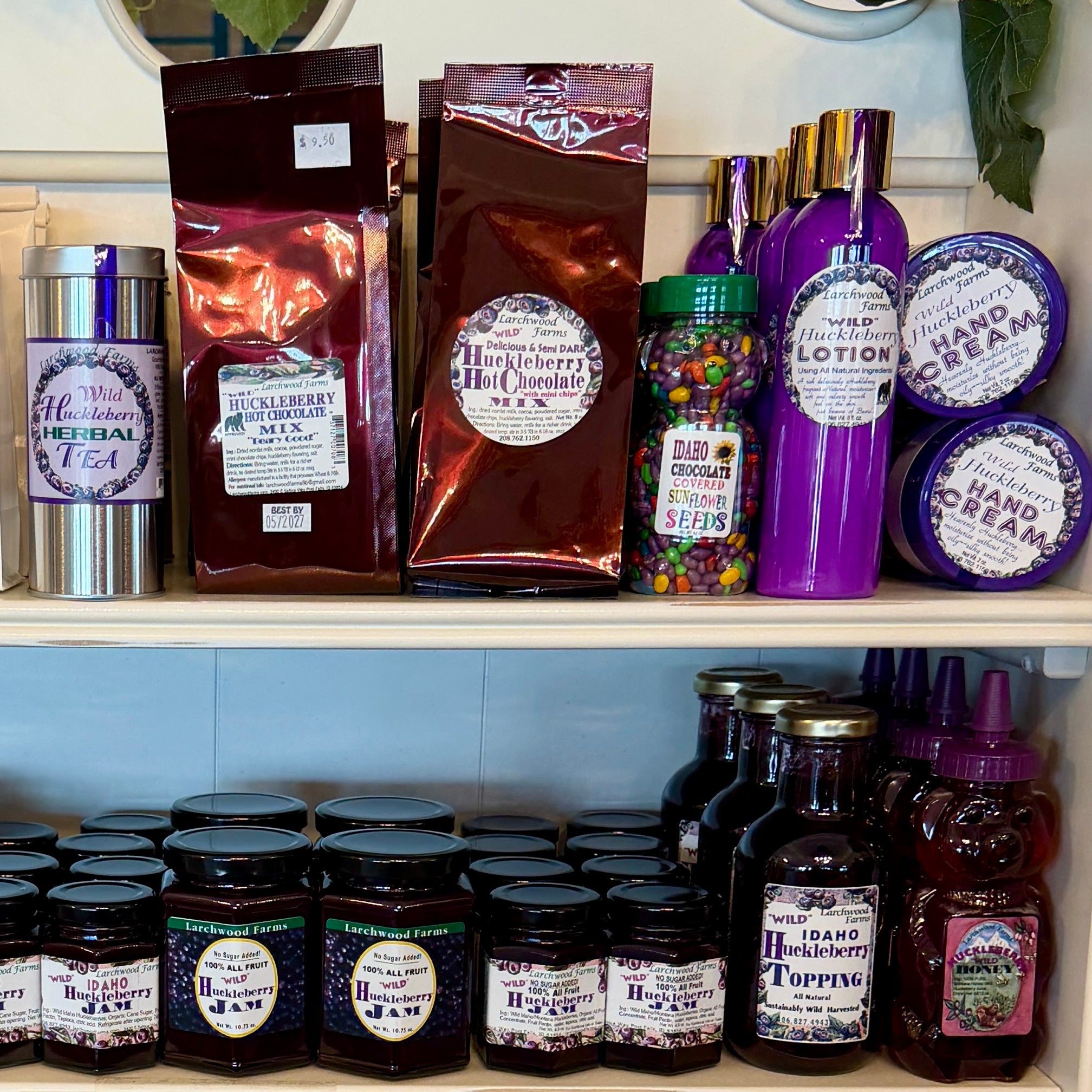 Shelf displaying a variety of products including jars, bottles, and containers with labels.