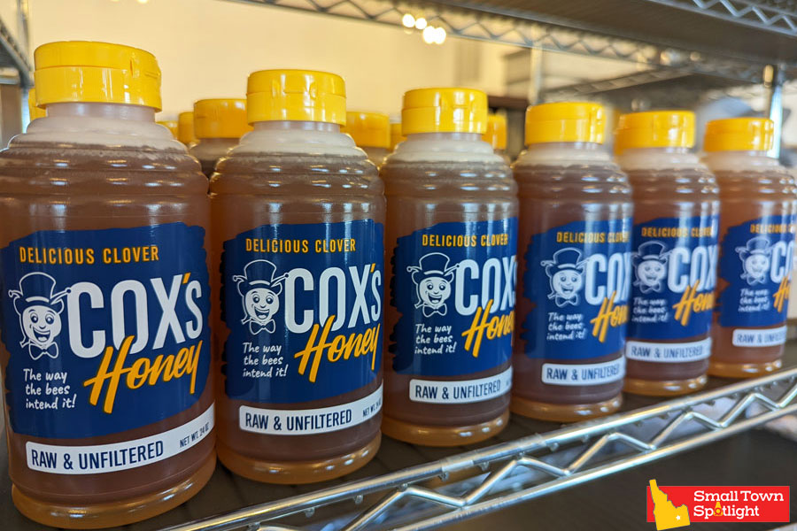 Cox's Honey clover bottles on the shelf in our honey stand. 