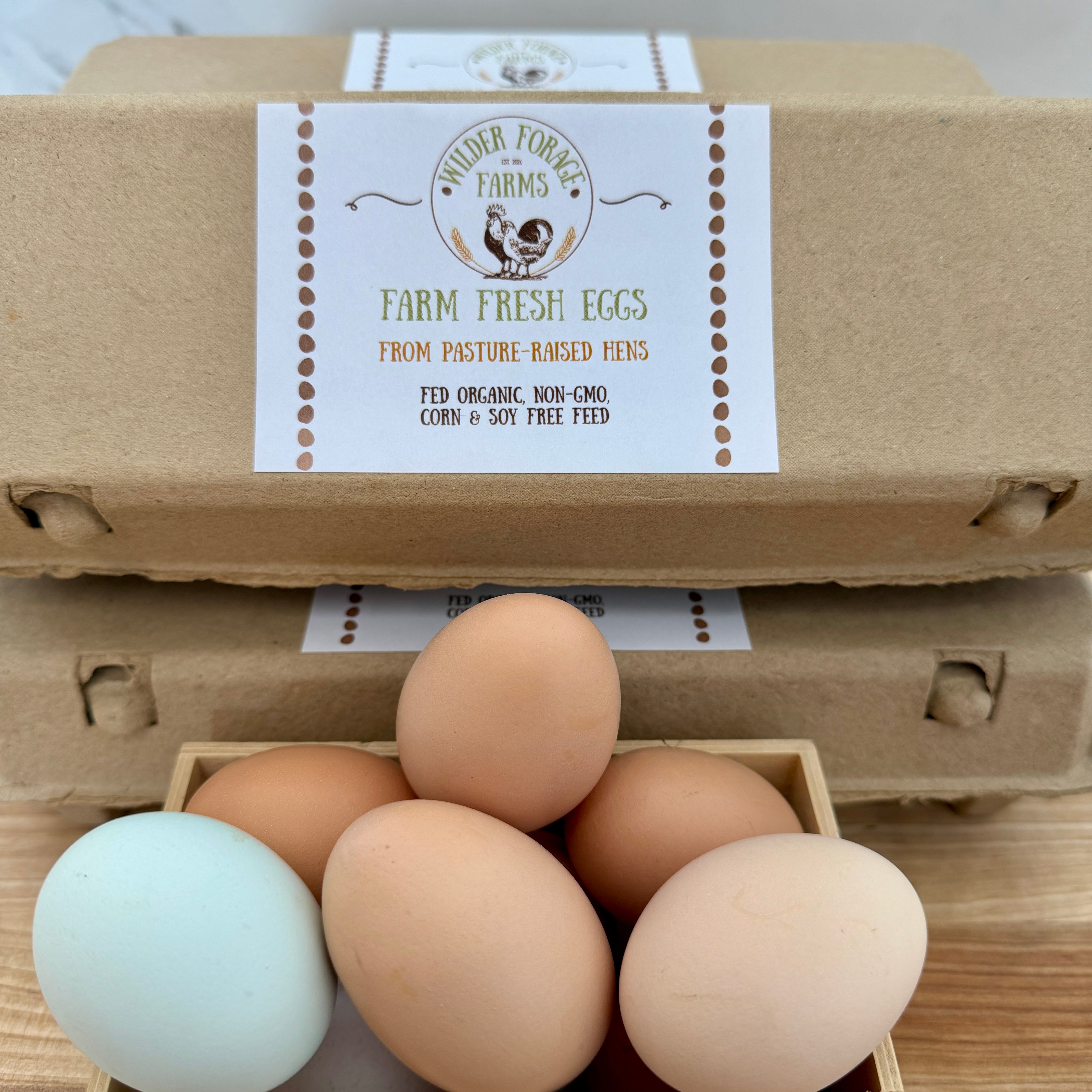 Carton of farm fresh eggs with a label on a wooden surface