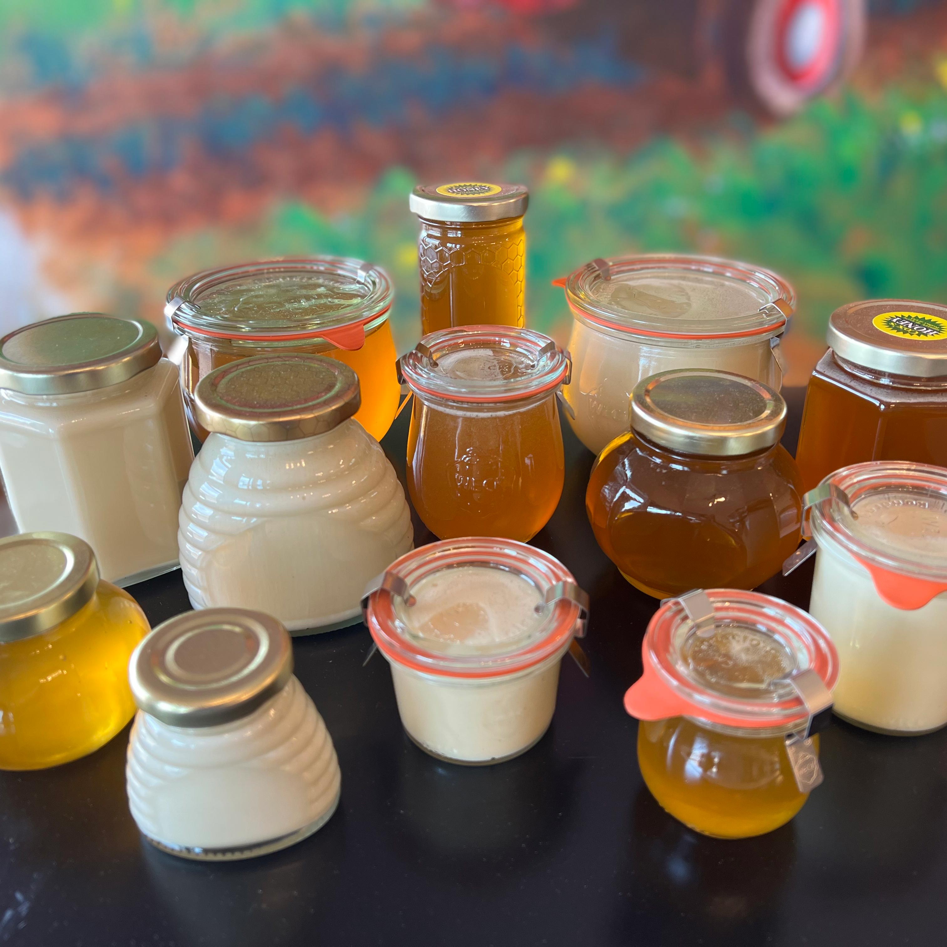 Coxs Honey Stand Glass Jars. Custom options are available. We carry a variety of honey glass jars. From hexagon to honey comb to weck jars.